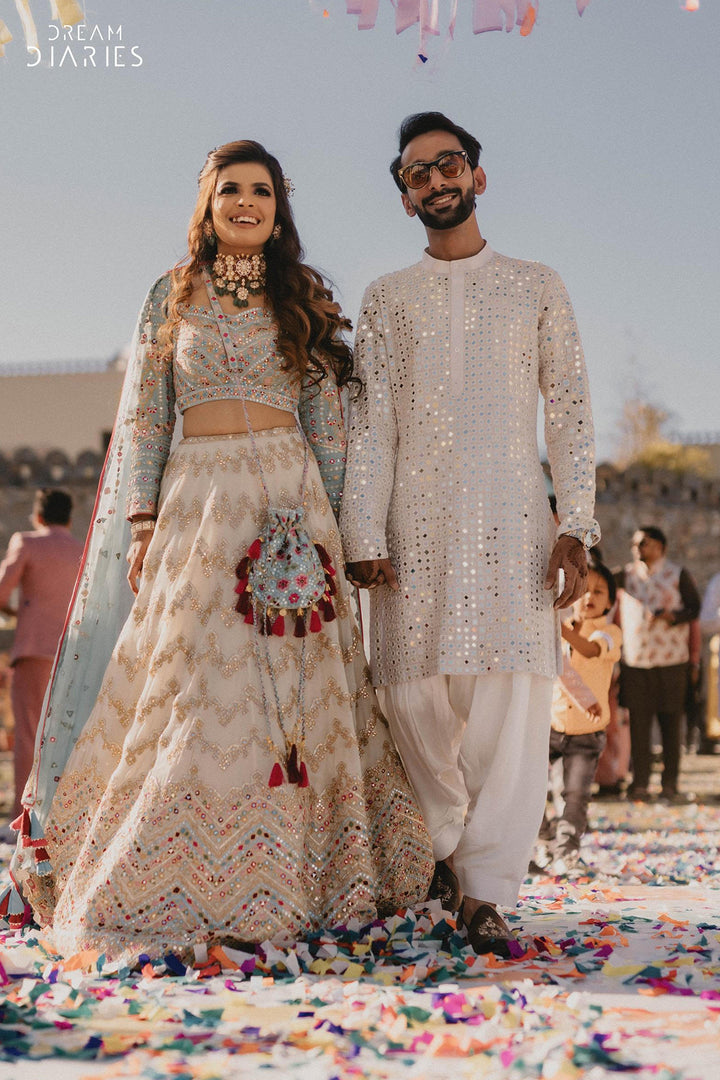 Jhanvi Kothari in Ivory Georgette Chevron Embroidered Lehenga Paired With A Blue Blouse And Organza Dupatta