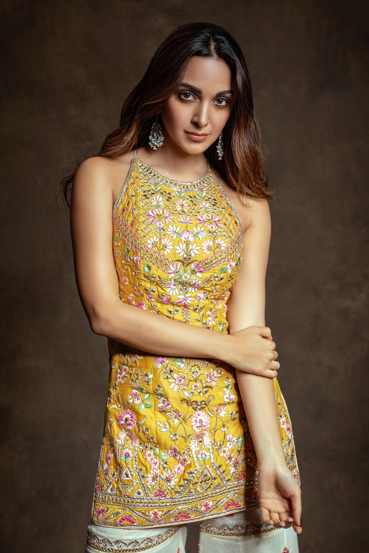 KIARA ADVANI IN MUSTARD HALTER KURTA WITH GHARARA