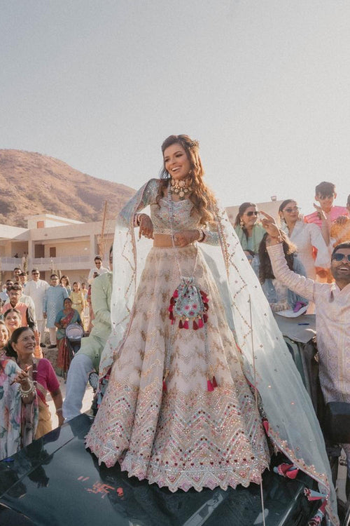 Jhanvi Kothari In Ivory Georgette Chevron Embroidered Lehenga Paired With A Blue Blouse And Organza Dupatta